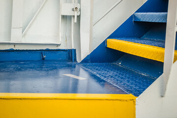 Stairs on a ferry moored in the harbor 