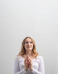 studio portrait of woman cunning plotting something and looking aside, isolated on background,...