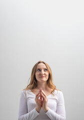 studio portrait of woman cunning plotting something and looking aside, isolated on background,...