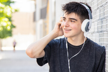 teen on the street with headphones