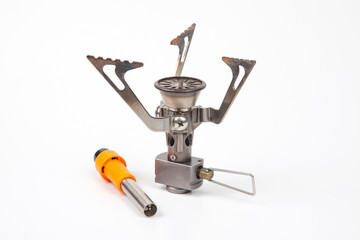 compact gas burner and lighter on a white background. tool for tourism and camping.