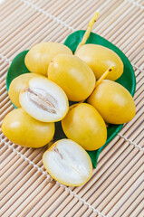 A bunch of fresh date palm fruits.