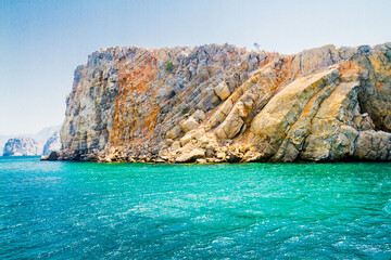 Fototapeta premium Fjords with beautiful rocks near Khasab, Musandam, Gulf of Oman