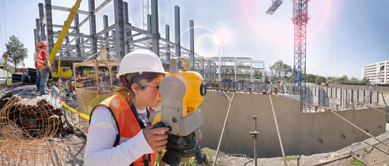 Topographical survey engineer in a building project
Panoramic view of a huge construction site
