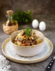 Braised chicken heart with rice, onions, carrots and mushrooms.
