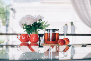 Still life of tea accessories and flowers