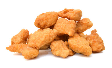 Heap of frozen bread crumbed chicken strips on white.