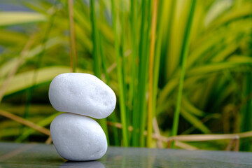 Obraz na płótnie Canvas zen stones on the grass