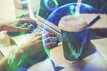 Double exposure of woman hands typing on computer and forex chart hologram drawing. Stock market invest concept.