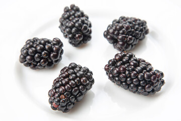 blackberries on white background. useful vitamin healthy food fruit. healthy vegetable breakfast