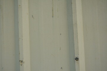 Metal sheet beige corrugated barrier use to set up a perimeter wall