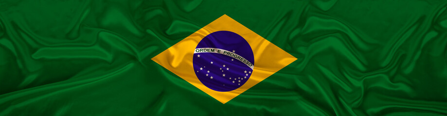 long panorama of the national flag of the state of Brazil on delicate silk with folds, the concept...