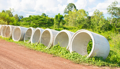 Cement pipes beside the countryside road.