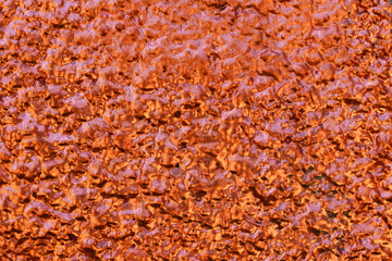 Gold and orange sprayed wall texture