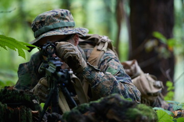 soldier in action aiming  on weapon  laser sight optics