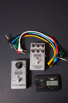 Vertical layout of MXR distortion pedals and tuner for guitar