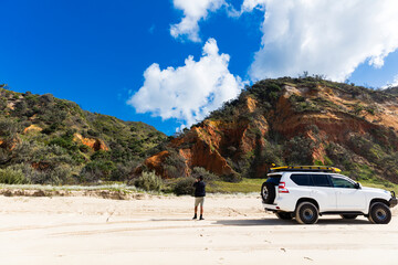 Off road vehicle in front of coloured sands on Fraser Island © Zstock