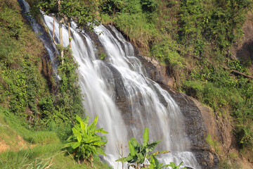 Fototapeta na wymiar the swift water of the cikondang waterfall.