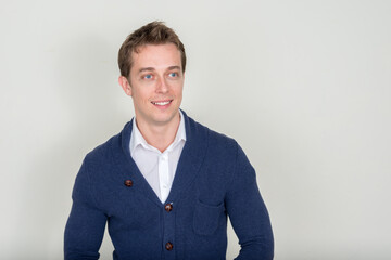 Portrait of happy handsome man against white background