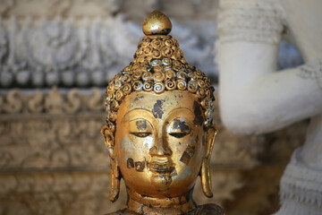 Close up face of buddha sculpture in Wat San Pa Yang Luang temple, lamphun city in North of Thailand