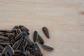 Sunflower seeds on the wooden floor