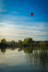 Hot air balloon over the Lake Velence, Village lake and hot air balloon