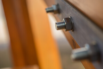 large nut and bolt on a wooden lookout tower