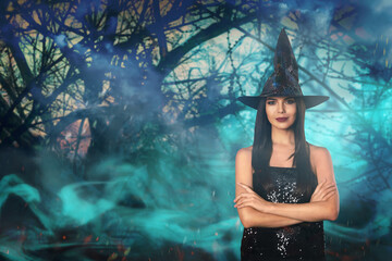 Witch and misty forest on background. Halloween celebration