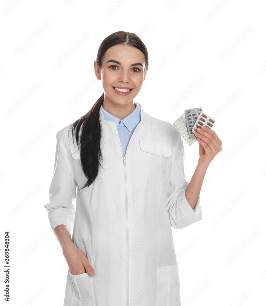 Wall mural Professional pharmacist with pills on white background