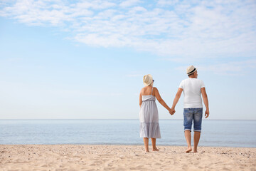 Mature couple spending time together on sea beach