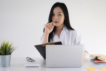 Portrait of Asian Business woman working from home. Accounting concept.