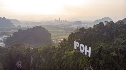 Aerial view of 'IPOH' landmark on a limestone mountain in Ipoh city, Malaysia.