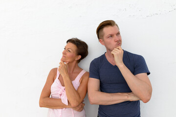 Portrait of mother and son together against white background