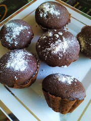 Homemade chocolate cupcakes on a white plate