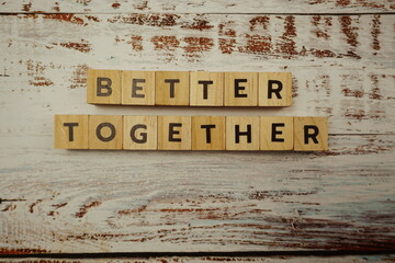 Better Together alphabet letter on wooden background