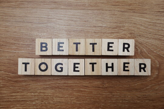 Better Together alphabet letter on wooden background