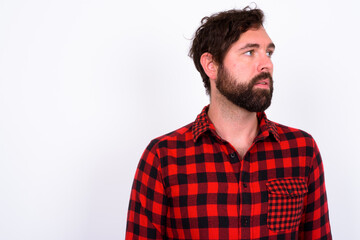 Obraz premium Portrait of handsome bearded hipster man against white background