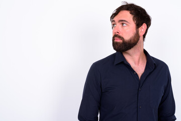 Obraz premium Portrait of handsome bearded businessman against white background