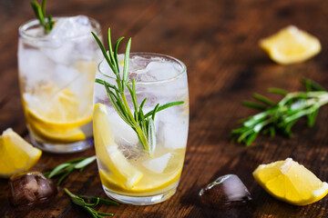 Lemon cocktail with rosemary and ice.
