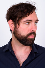 Fototapeta premium Portrait of handsome bearded businessman against white background