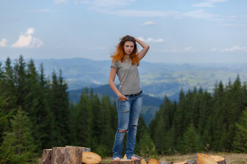 girl posing and gesturing in the mountains