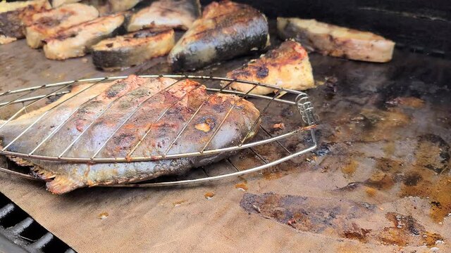 Grilling pampano fish and milkfish