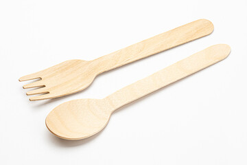 Eco natural wooden spoon and fork on white background