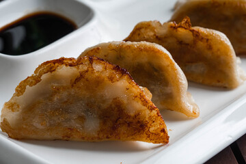 Japanese gyoza or dumplings snack with soy sauce