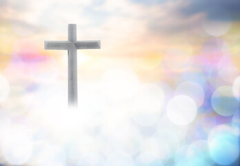 Wooden cross with bokeh blur background