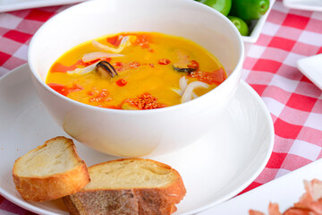 Traditional Italian cuisine, Italian concept. Sea food soup in a bowl on the table.