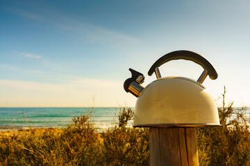 Kettle outdoor on sea shore