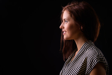 Portrait of happy young beautiful businesswoman with brown hair
