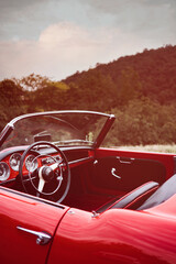 Red Classic Car in the countryside