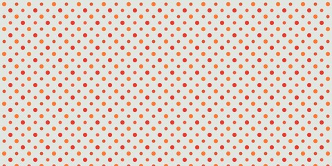 互い違いに配置された大きさと色の異なるドット模様